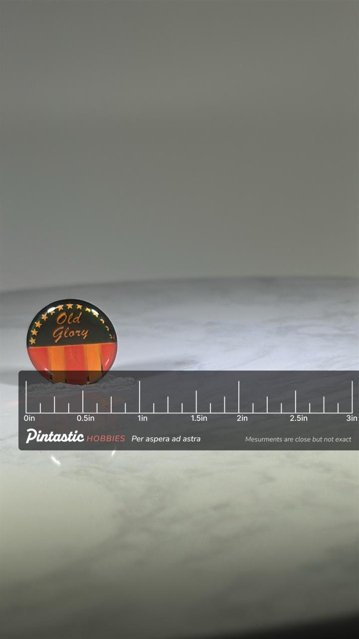 Old Glory Patriotic Pin: Red Gold Black Finish - Vintage Americana Accessory with ruler overlay for size reference