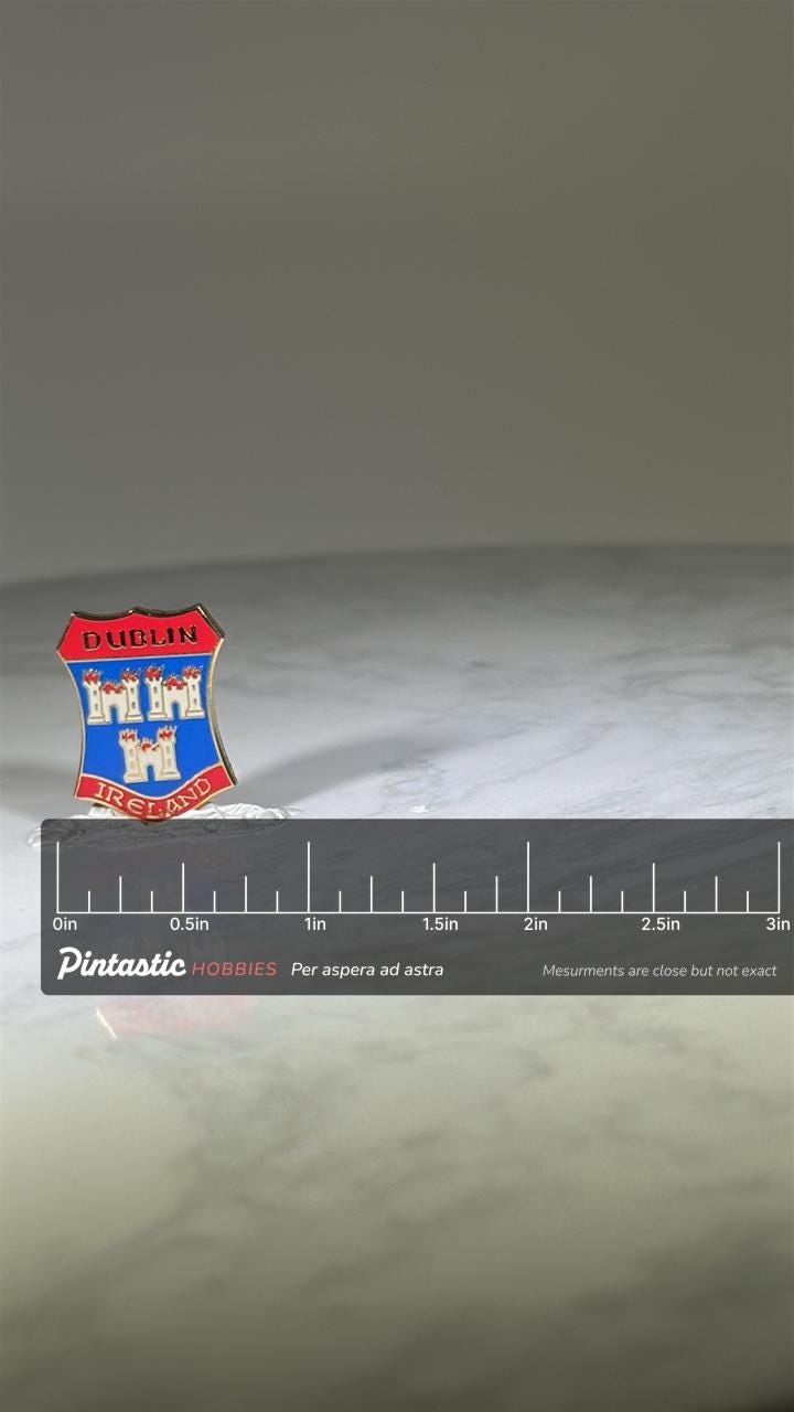 Dublin Ireland Crest Pin: Red Blue Enamel Finish - Souvenir Travel Accessory with ruler overlay for size reference