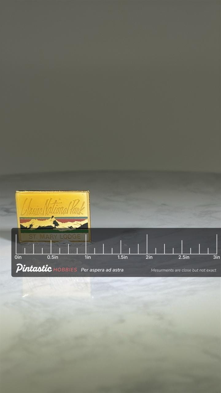 Glacier National Park Pin: Gold Enamel Rectangle - Vintage Travel Accessory with ruler overlay for size reference
