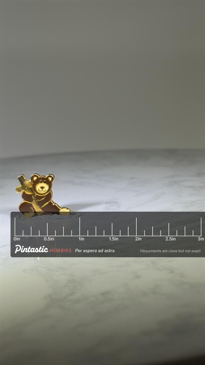 Teddy Bear with Cross Lapel Pin: Gold & Brown Enamel - Faith-Inspired Accessory with ruler overlay for size reference