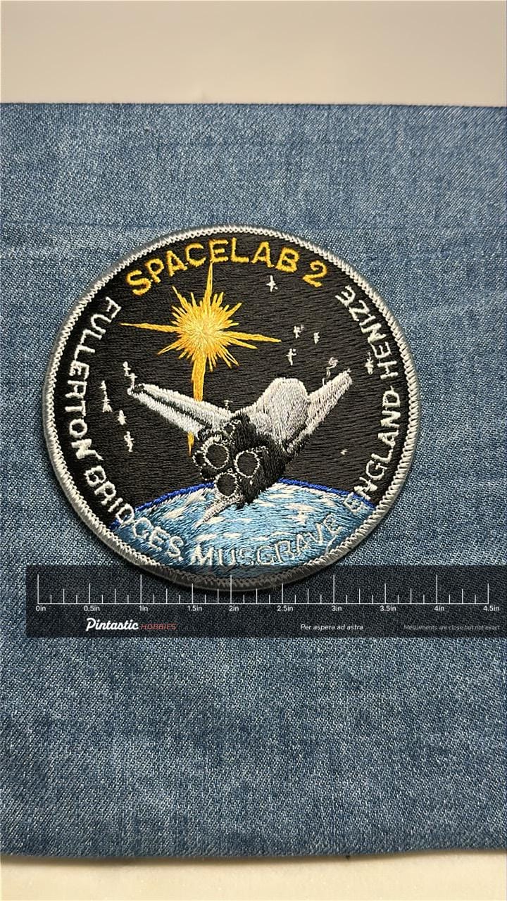 Spacelab 2 Collectable Iron-On Patch: Black & Silver Colored - NASA Shuttle Era Accessory with ruler overlay for size referen