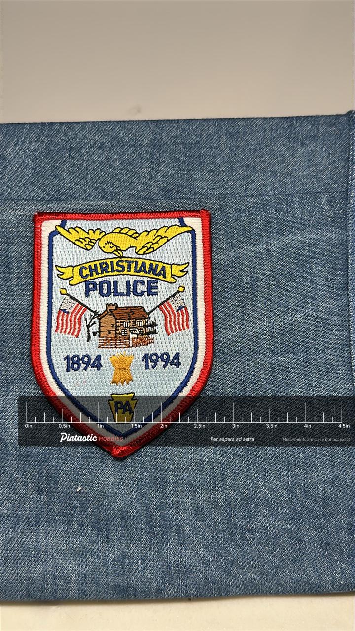 Christiana Police Collectable Patch: Iron-On Shield Red-White-Blue - 1994 Souvenir with ruler overlay for size reference