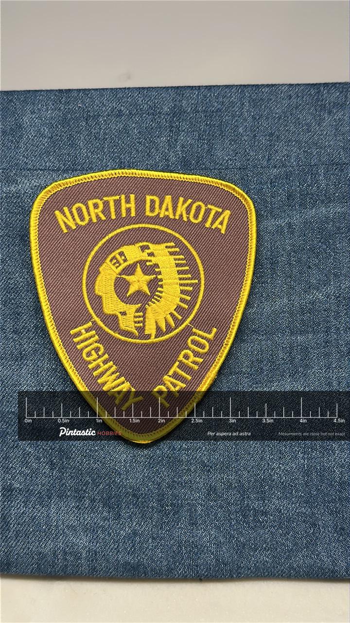 North Dakota Highway Patrol Collectable Patch: Sew-On Brown Gold - Police Accessory with ruler overlay for size reference