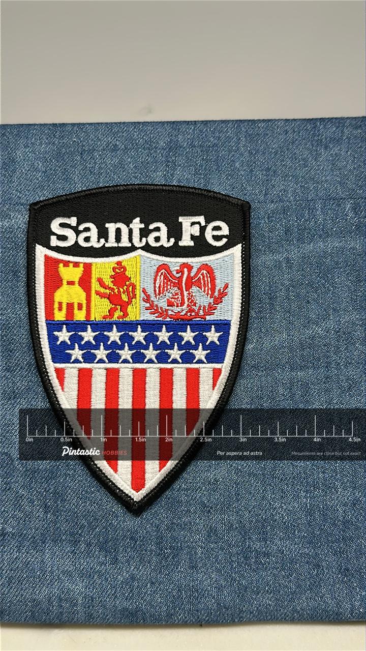 Santa Fe Collectable Patch: Iron-On Shield Red White Blue - City Pride Accessory with ruler overlay for size reference