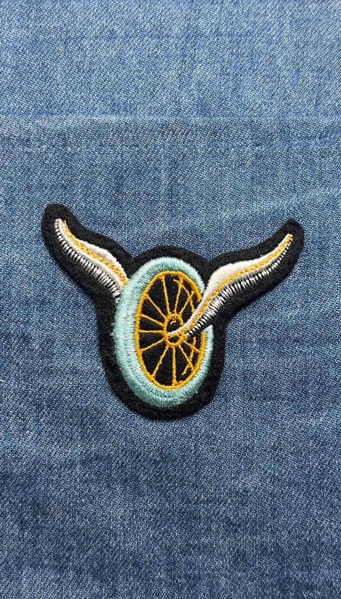 Winged Wheel Collectable Patch: Sew-On Black/Yellow - Vintage Style Accessory