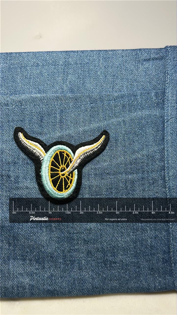 Winged Wheel Collectable Patch: Sew-On Black/Yellow - Vintage Style Accessory with ruler overlay for size reference