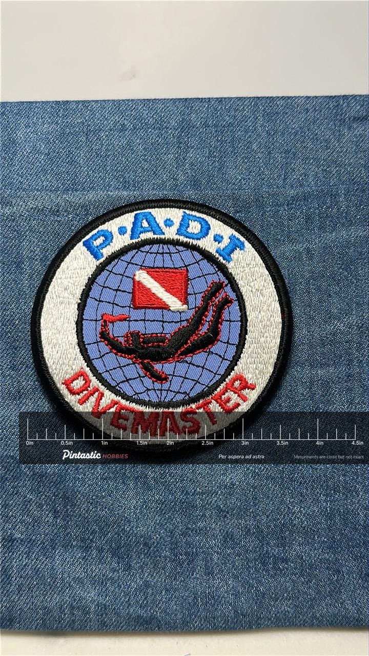 PADI Divemaster Collectable Patch: Iron-On Round Red/Blue - Scuba Accessory with ruler overlay for size reference