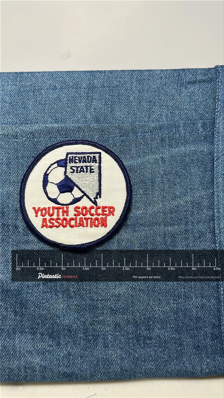 Nevada Soccer Association Patch: Sew-On Red/Blue - Youth Sports Accessory with ruler overlay for size reference