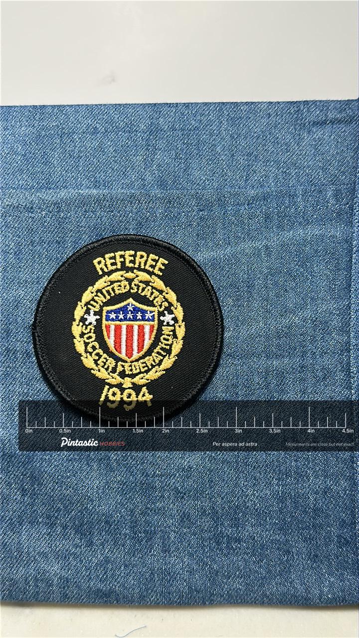 US Soccer Referee Collectable Patch: Iron-On Black Gold - 1994 Accessory with ruler overlay for size reference