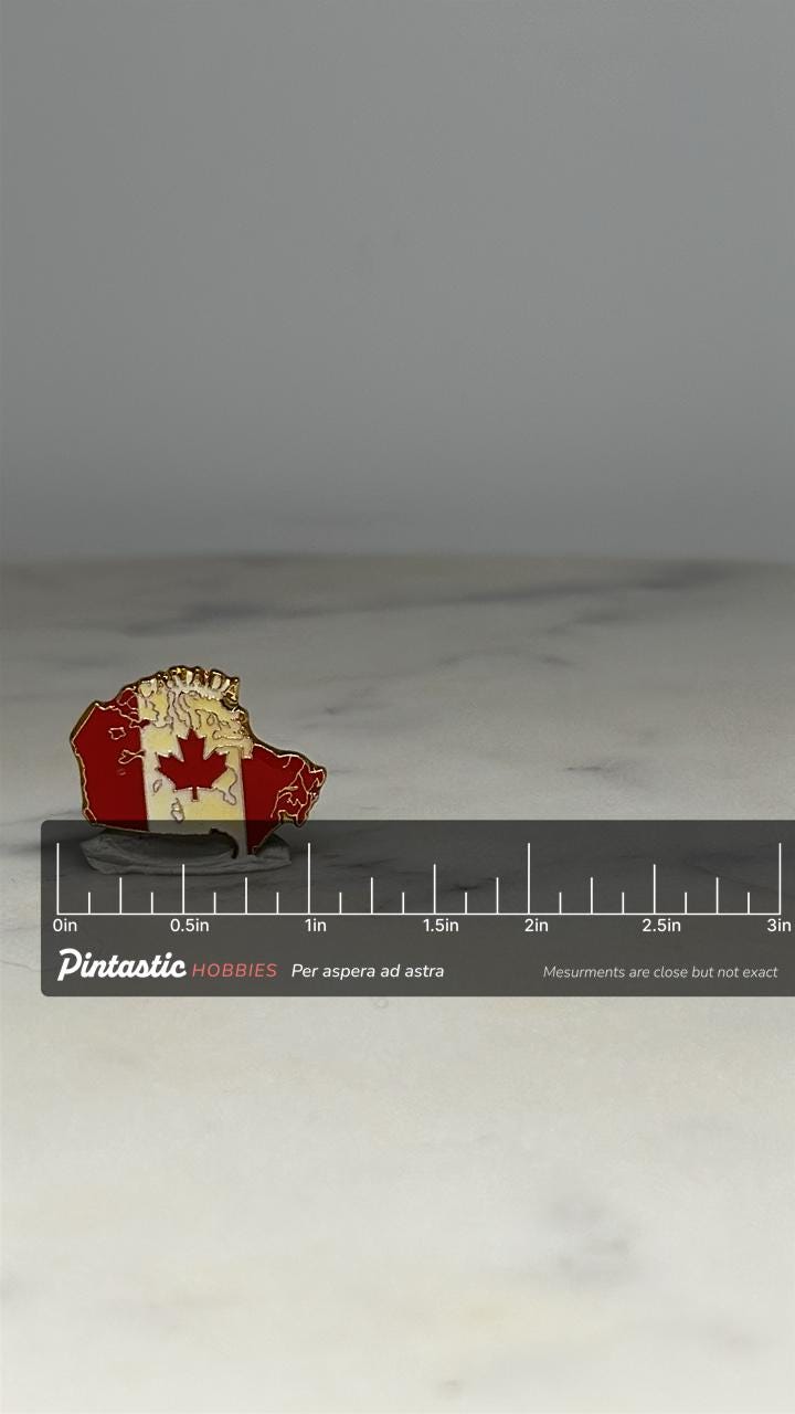 Canada Flag Lapel Pin: Red Enamel Gold Trim - Patriotic Accessory with ruler overlay for size reference