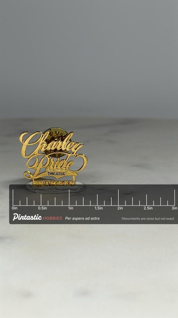 Charley Pride Theatre Pin: Gold Tone Script - Branson Music Souvenir with ruler overlay for size reference