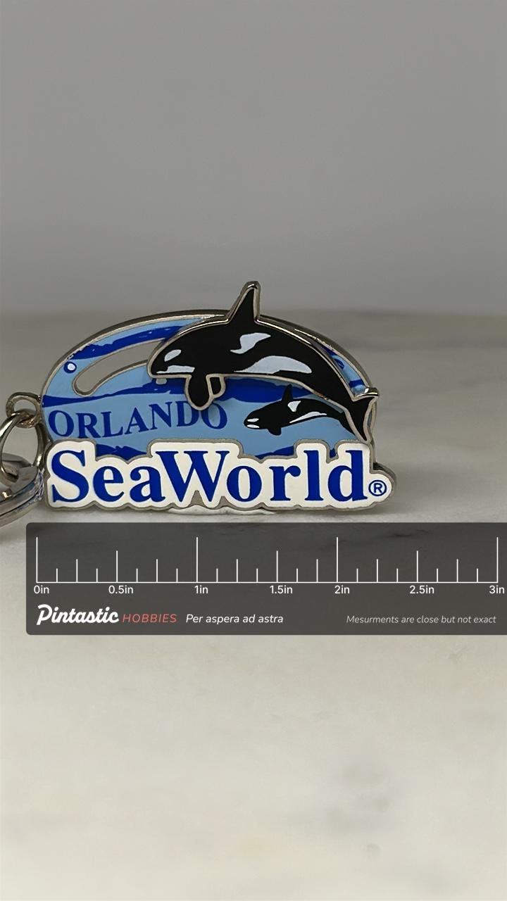 SeaWorld Orlando Keychain: Blue Enamel & Silver-Tone - Marine Park Accessory with ruler overlay for size reference