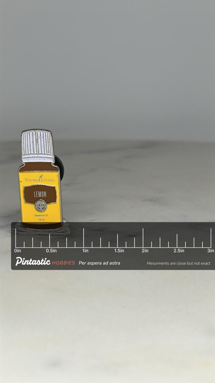 Young Living Lemon Essential Oil Pin: Yellow Enamel Finish - Wellness Accessory with ruler overlay for size reference