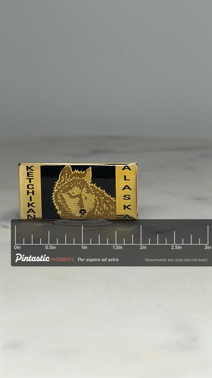 Ketchikan Alaska Wolf Pin: Gold & Black Enamel - Vintage Travel Accessory with ruler overlay for size reference
