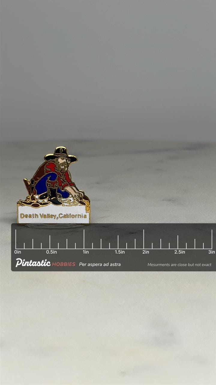 Death Valley Prospector Pin: Gold Enamel Finish - Vintage Travel Accessory with ruler overlay for size reference