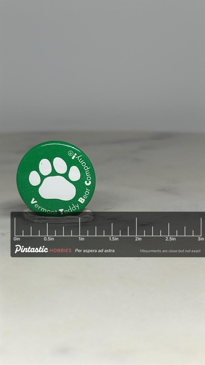 Vermont Teddy Bear Company Pin: Green Paw Design - Vintage Collectible Accessory with ruler overlay for size reference