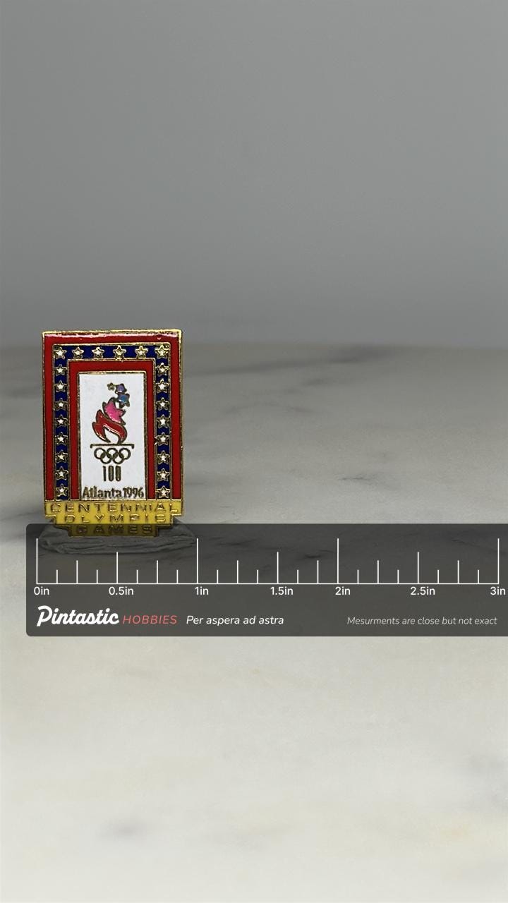 Atlanta 1996 Olympic Pin: Gold Red White Blue Enamel - Centennial Games Accessory with ruler overlay for size reference