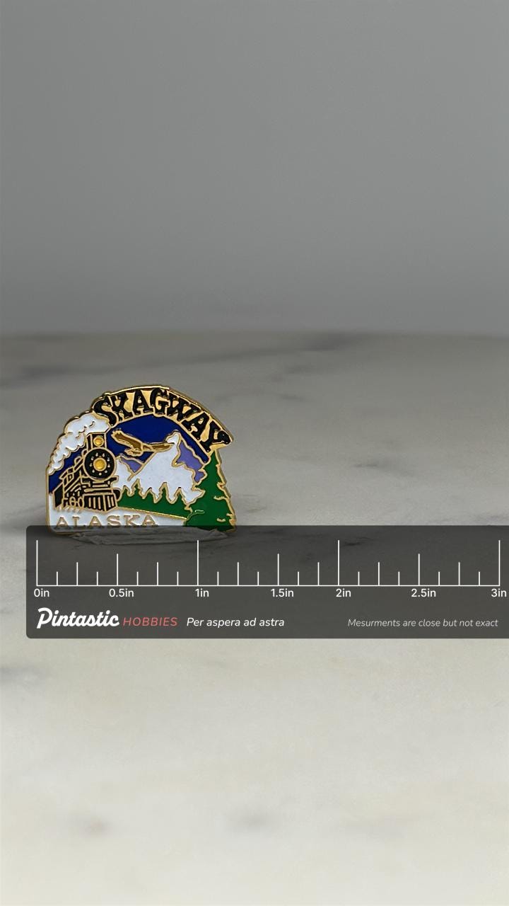 Skagway Alaska Souvenir Pin: Multicolor Enamel - Vintage Travel Accessory with ruler overlay for size reference