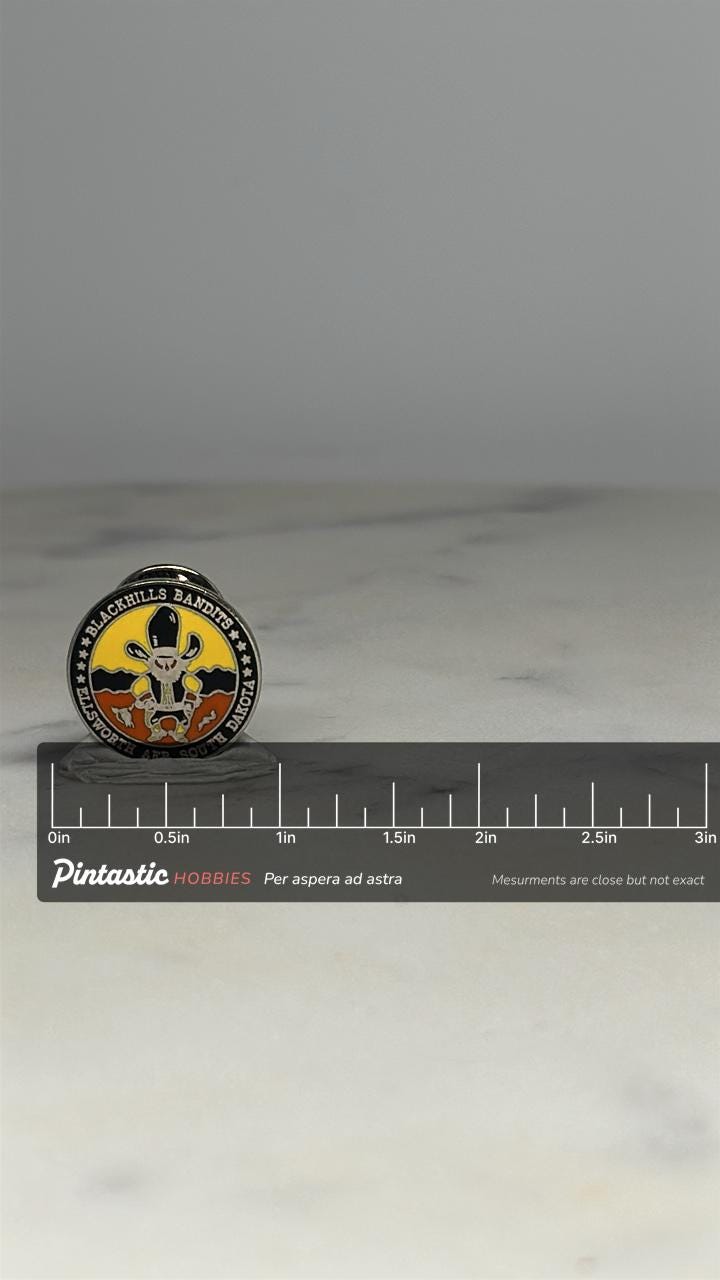 Blackhills Bandits Lapel Pin: Bold Enamel Finish - Military Souvenir Accessory with ruler overlay for size reference