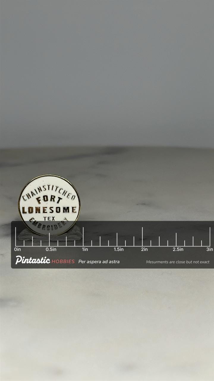 Fort Lonesome Logo Pin: White Enamel Finish - Modern Western Accessory with ruler overlay for size reference