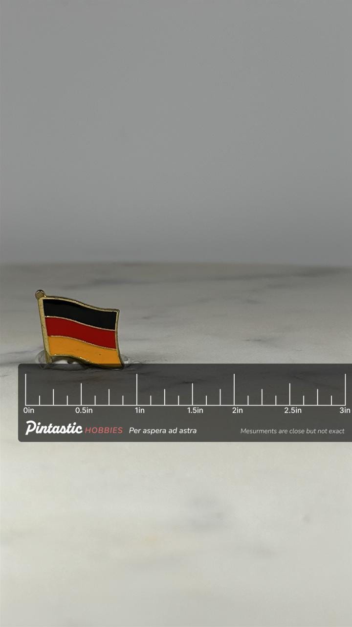 Germany Flag Pin: Gold Trim Enamel - Patriotic Travel Accessory with ruler overlay for size reference