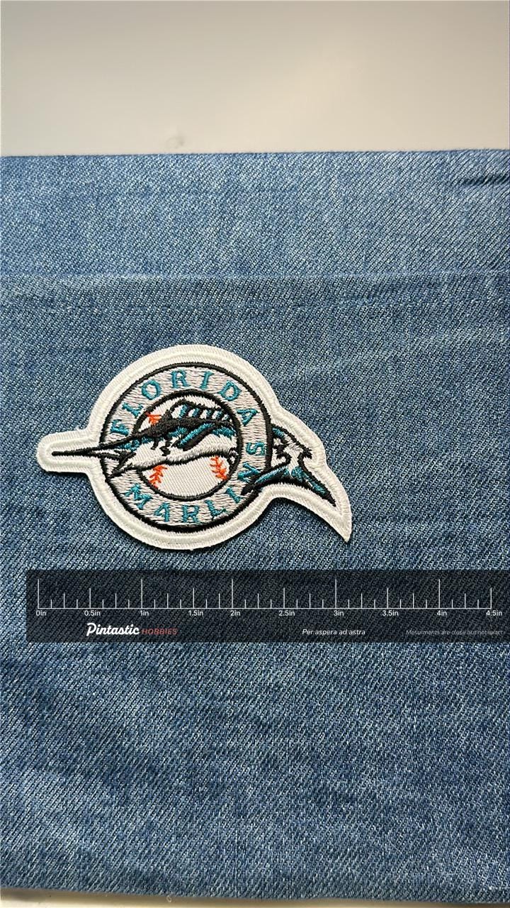 Florida Marlins Collectable Patch: Sew-On Classic White Trim - 1990s Sports Accessory with ruler overlay for size reference