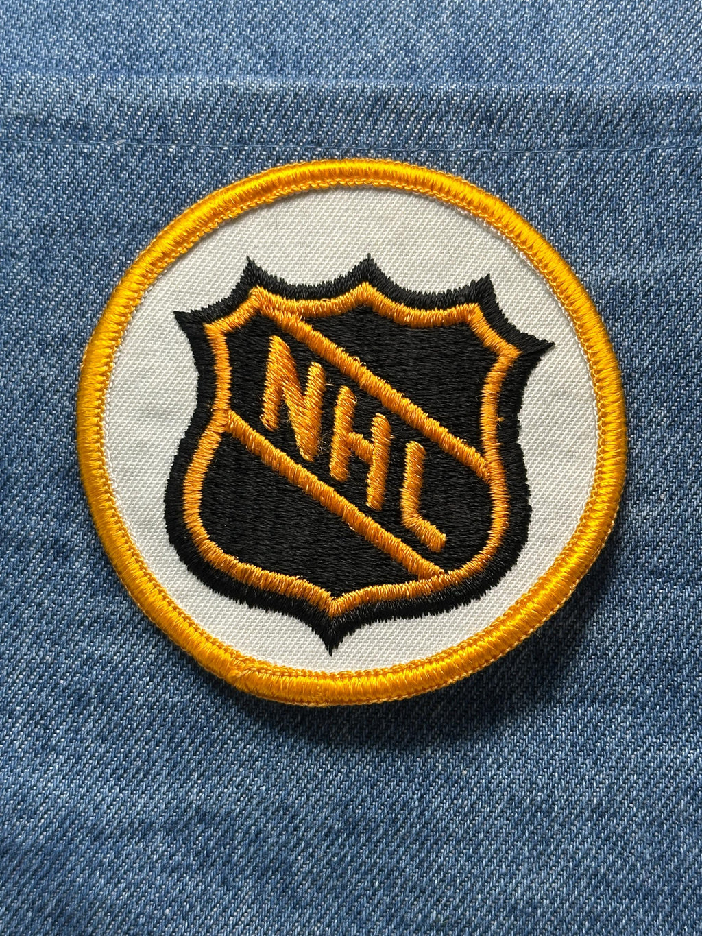 NHL League Collectable Patch: Sew-On Black & Gold Shield - Vintage Sports Accessory