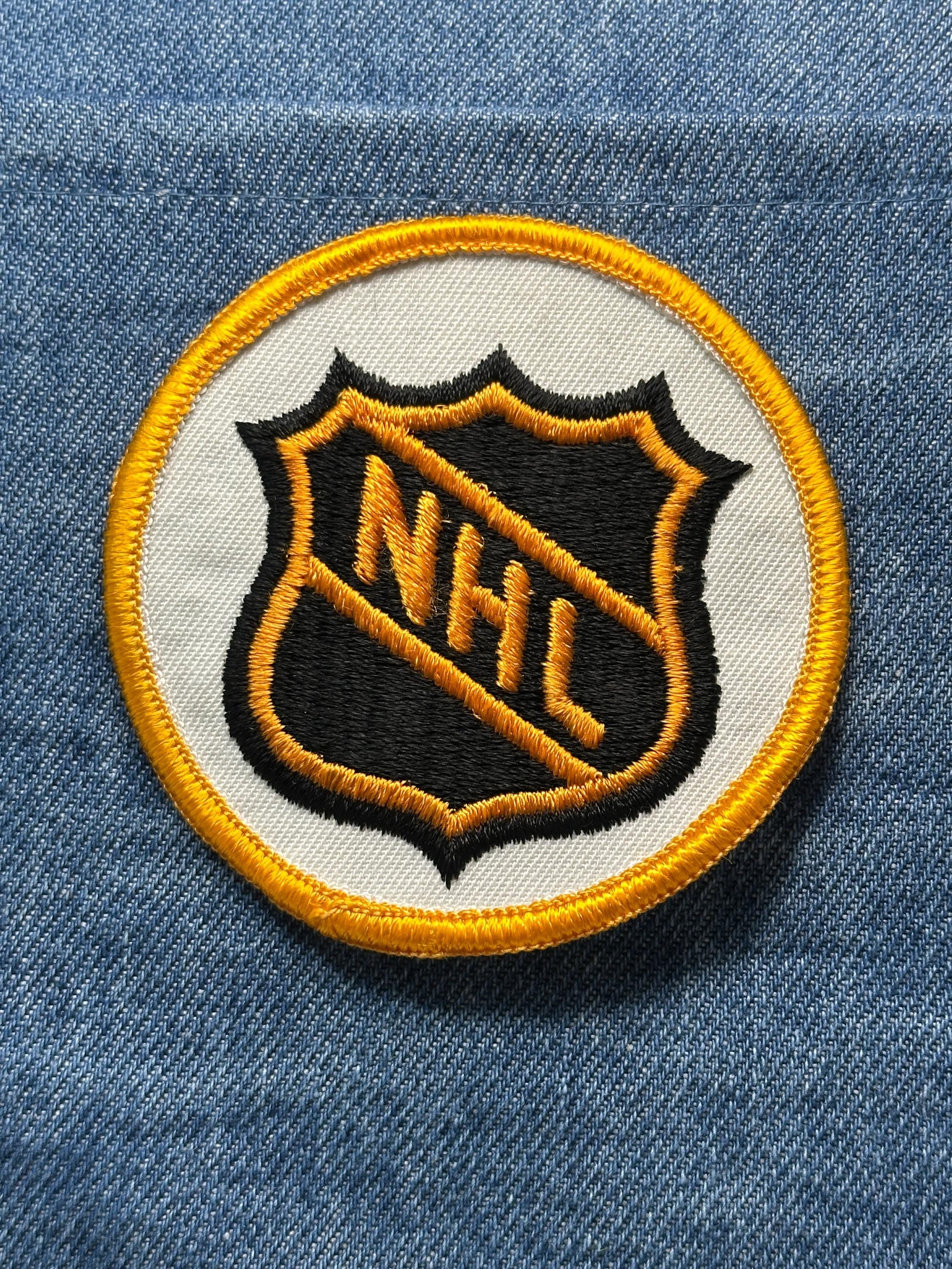 NHL League Collectable Patch: Sew-On Black & Gold Shield - Vintage Sports Accessory