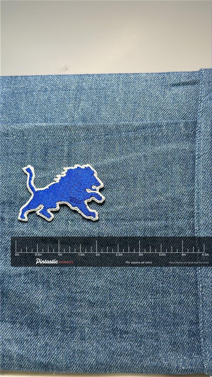 Detroit Lions Patch: Iron-On Blue Outline - Vintage Sports Accessory with ruler overlay for size reference