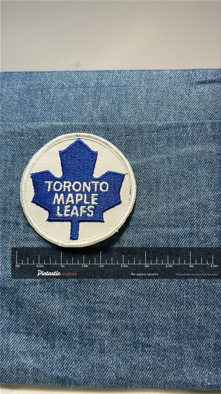 Toronto Maple Leafs Collectable Patch: Sew-On Blue/White - Vintage Sports Accessory with ruler overlay for size reference
