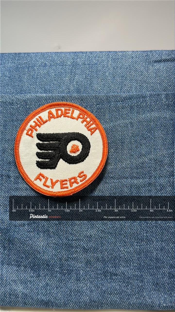 Philadelphia Flyers Collectable Patch: Sew-On Round Orange Trim - Vintage Sports Accessory with ruler overlay for size refere