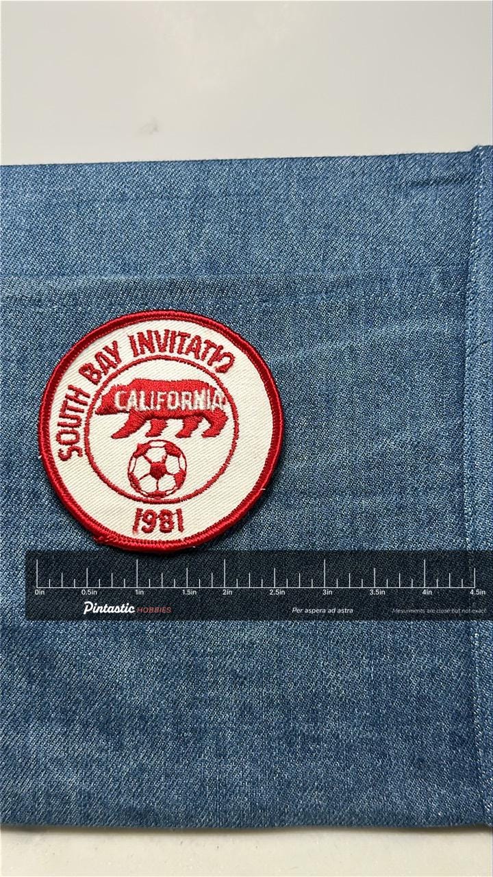 South Bay Invitational Patch: Sew-On Red/White - 1981 Soccer Accessory with ruler overlay for size reference
