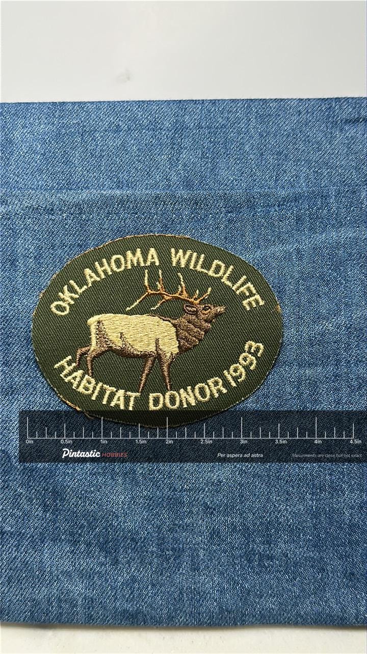 Oklahoma Wildlife Patch: Iron-On Olive Green Oval - 1993 Donor Accessory with ruler overlay for size reference