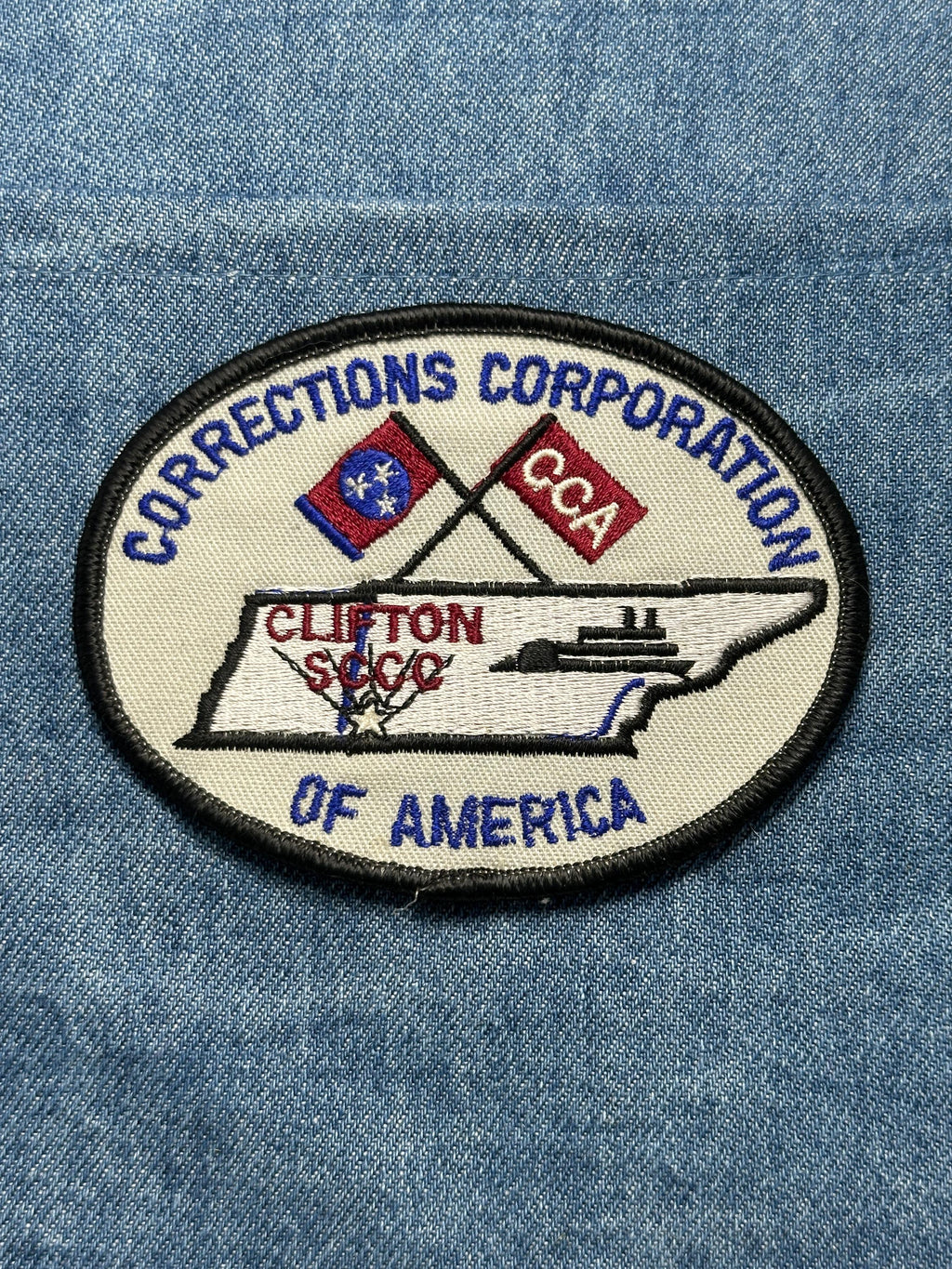 Corrections Corporation Collectable Patch: Iron-On Oval Red/Blue - Gov/Prison Accessory