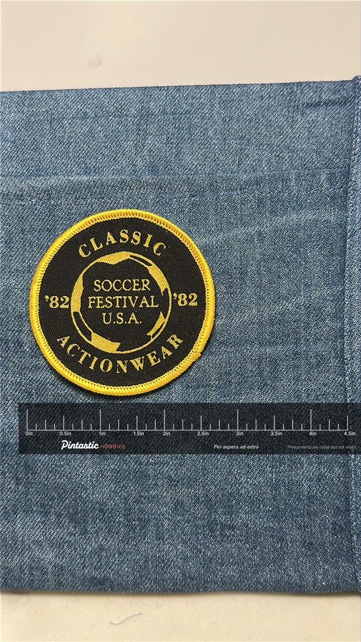 Soccer Festival USA Patch: Sew-On Black/Yellow - 1982 Sports Accessory with ruler overlay for size reference