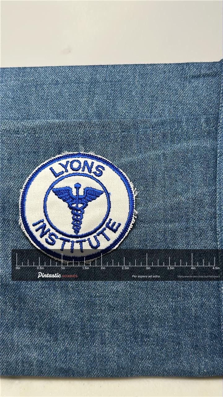 Lyons Institute Collectable Patch: Iron-On Blue & White - Medical Accessory with ruler overlay for size reference