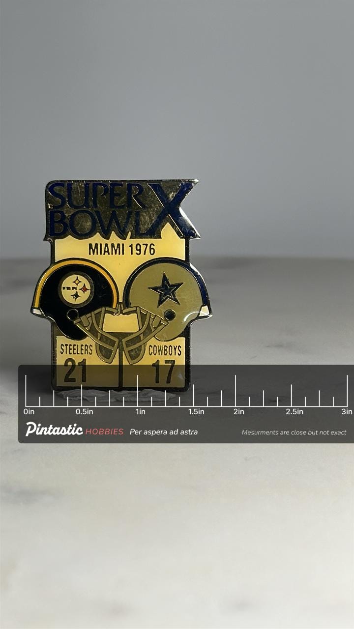 Super Bowl X Football Pin: Gold Enamel Finish - 1976 Steelers vs Cowboys with ruler overlay for size reference