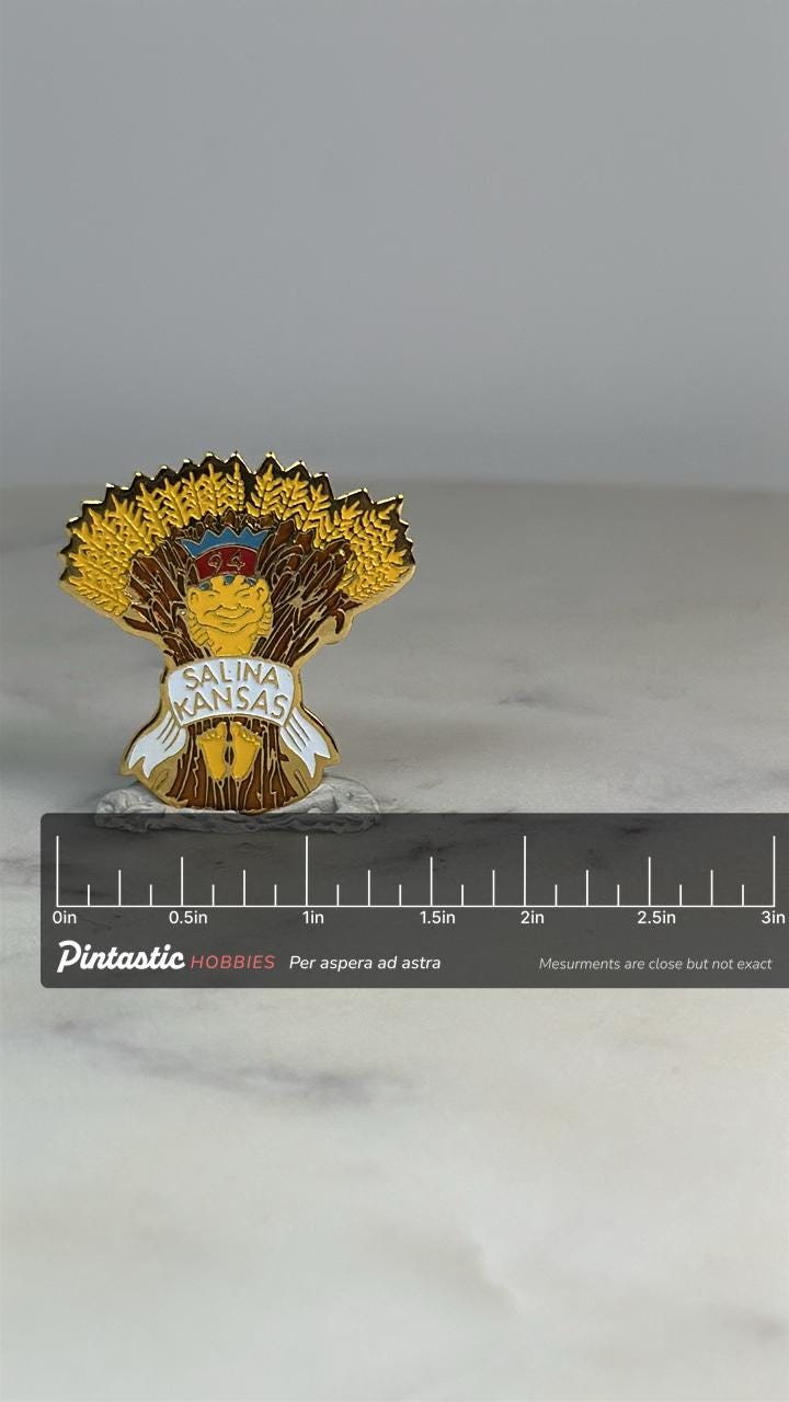 Salina Kansas Collector Pin: Enamel Gold Wheat Sheaf - 1994 Souvenir Accessory with ruler overlay for size reference