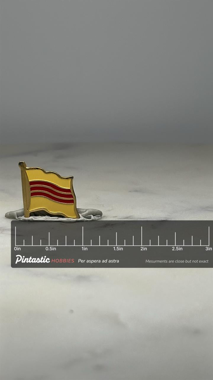 South Vietnam Flag Pin: Gold & Red Enamel - Vintage Patriotic Accessory with ruler overlay for size reference
