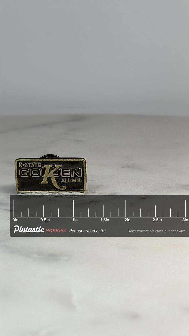 K-State Golden K Alumni Pin: Brass Finish - Collegiate Accessory with ruler overlay for size reference