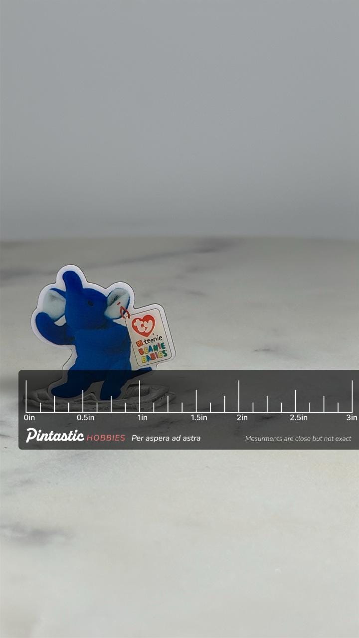 Beanie Babies Elephant Pin: Blue Colored - 90s Toy Accessory with ruler overlay for size reference