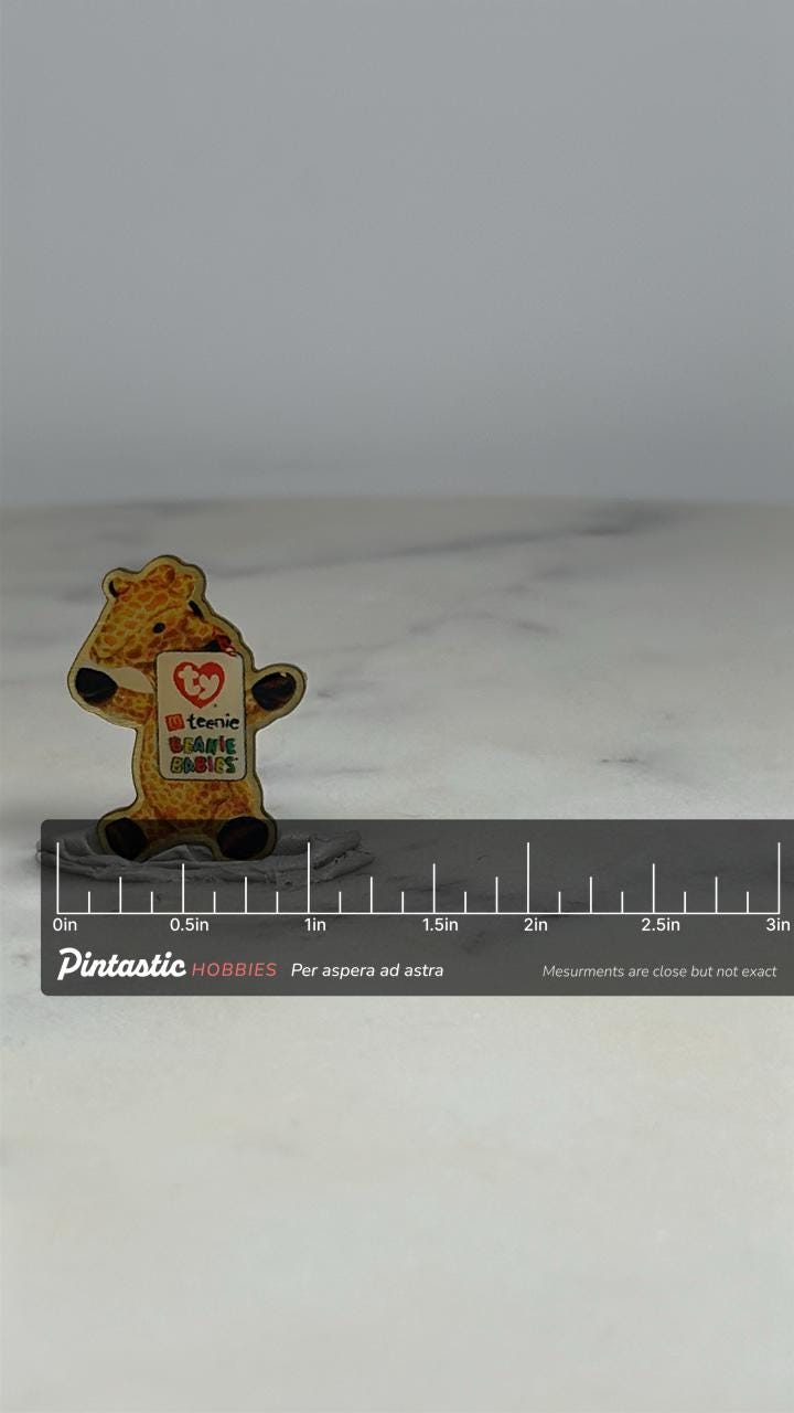 Beanie Babies Giraffe Pin: Glossy Finish - 90s Collectible Accessory with ruler overlay for size reference