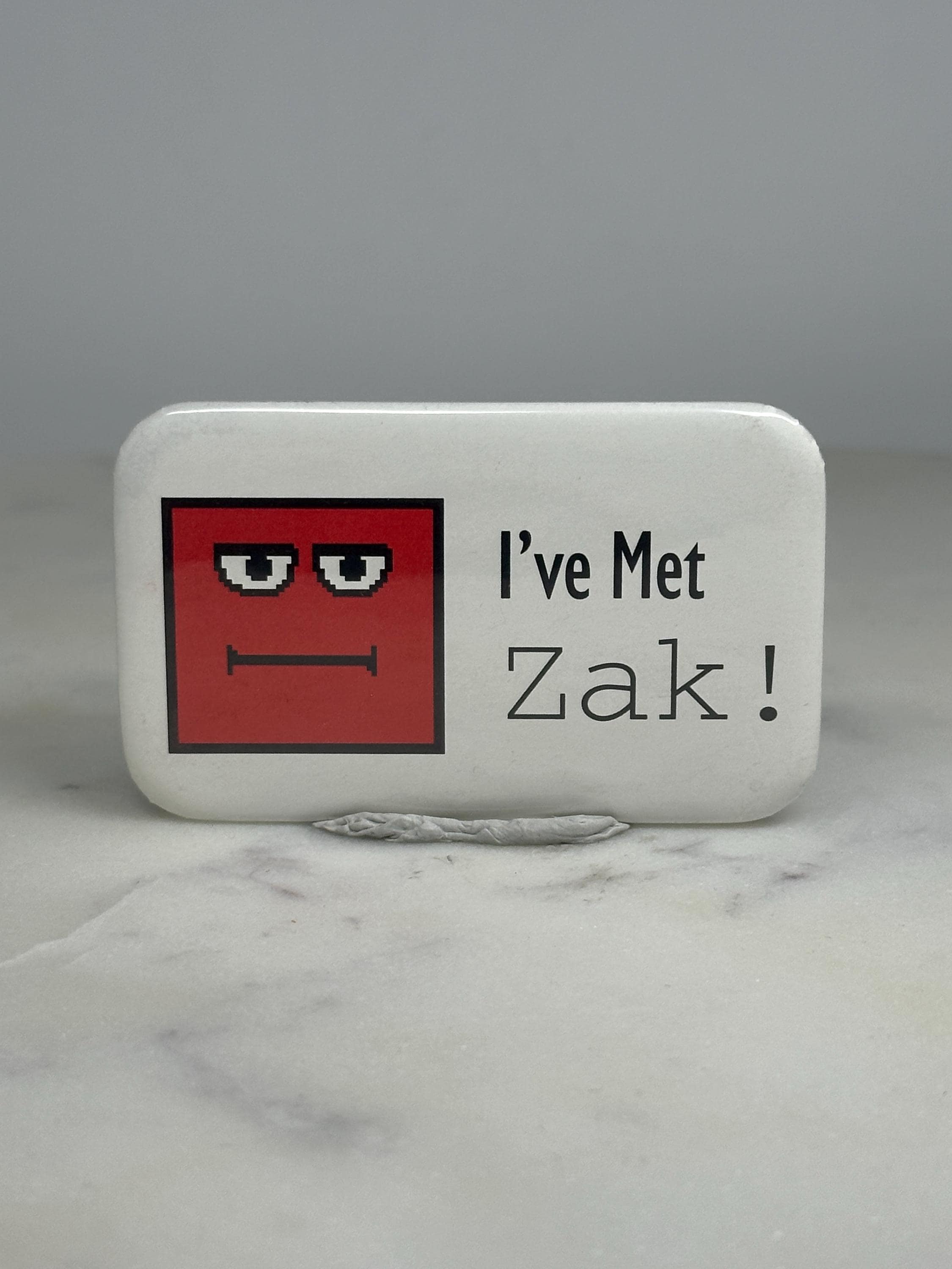 Zak Character Pin: Red Pixel Art Face - Retro Collectible Accessory
