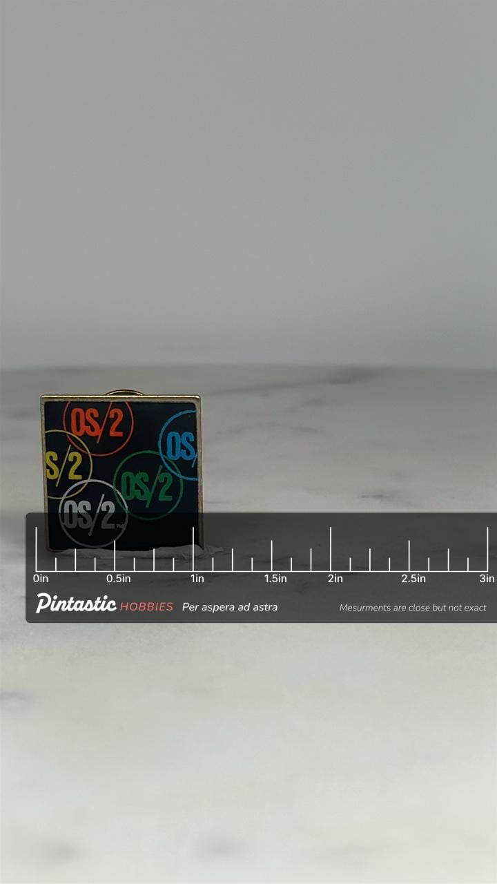 IBM OS/2 Logo Pin: Multicolor Black Enamel - Vintage Tech Accessory with ruler overlay for size reference