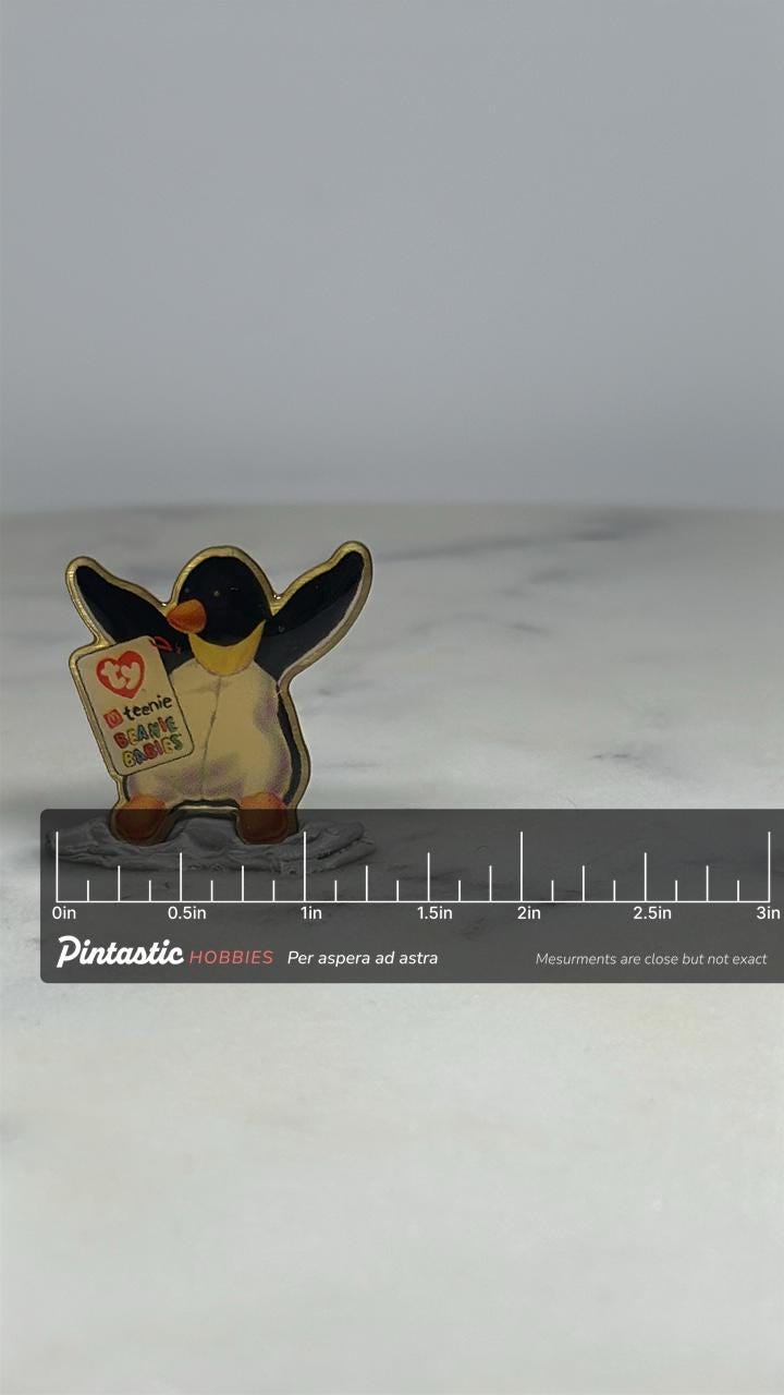 Beanie Babies Penguin Pin: Glossy Finish - 1990s Collectible Accessory with ruler overlay for size reference