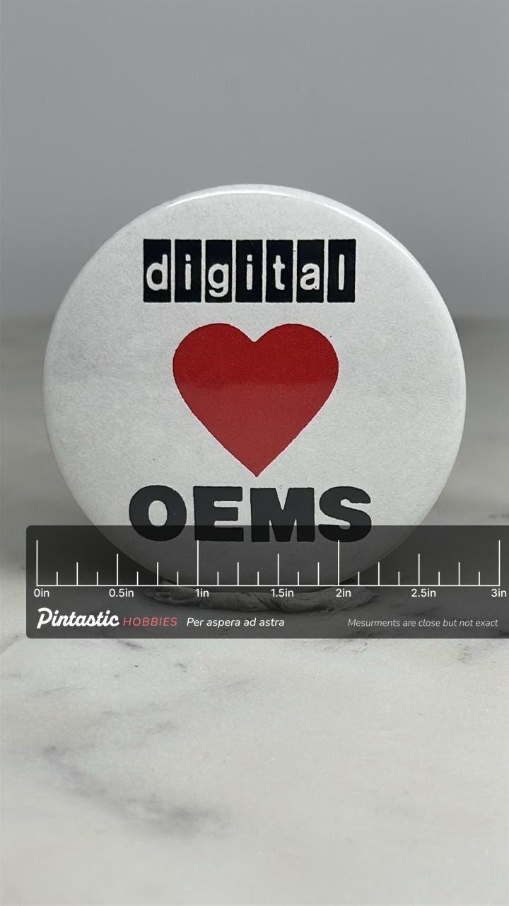 Digital OEMS Button Pin: Retro White & Red - 90s Tech Accessory with ruler overlay for size reference