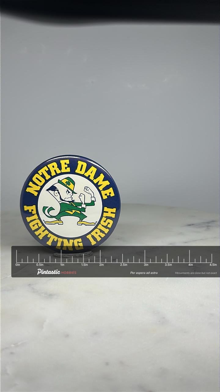 Notre Dame Fighting Irish Button Pin: Bold Colors - Vintage College Accessory with ruler overlay for size reference
