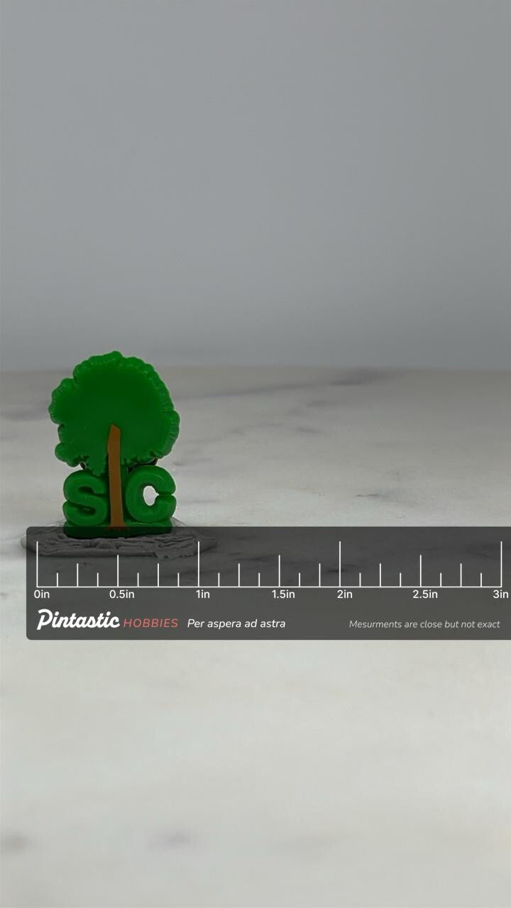 SIC Tree Logo Pin: Green Plastic Finish - Vintage Nature Accessory with ruler overlay for size reference