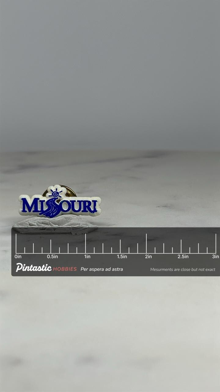 Missouri Souvenir Pin: White & Blue Enamel - Travel Collectible Accessory with ruler overlay for size reference