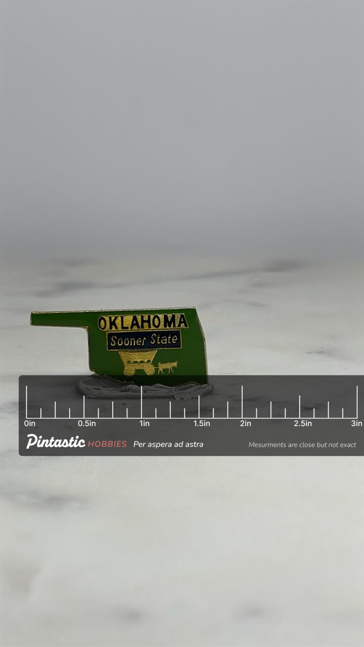 Oklahoma State Souvenir Pin: Green Enamel - Vintage Travel Accessory with ruler overlay for size reference